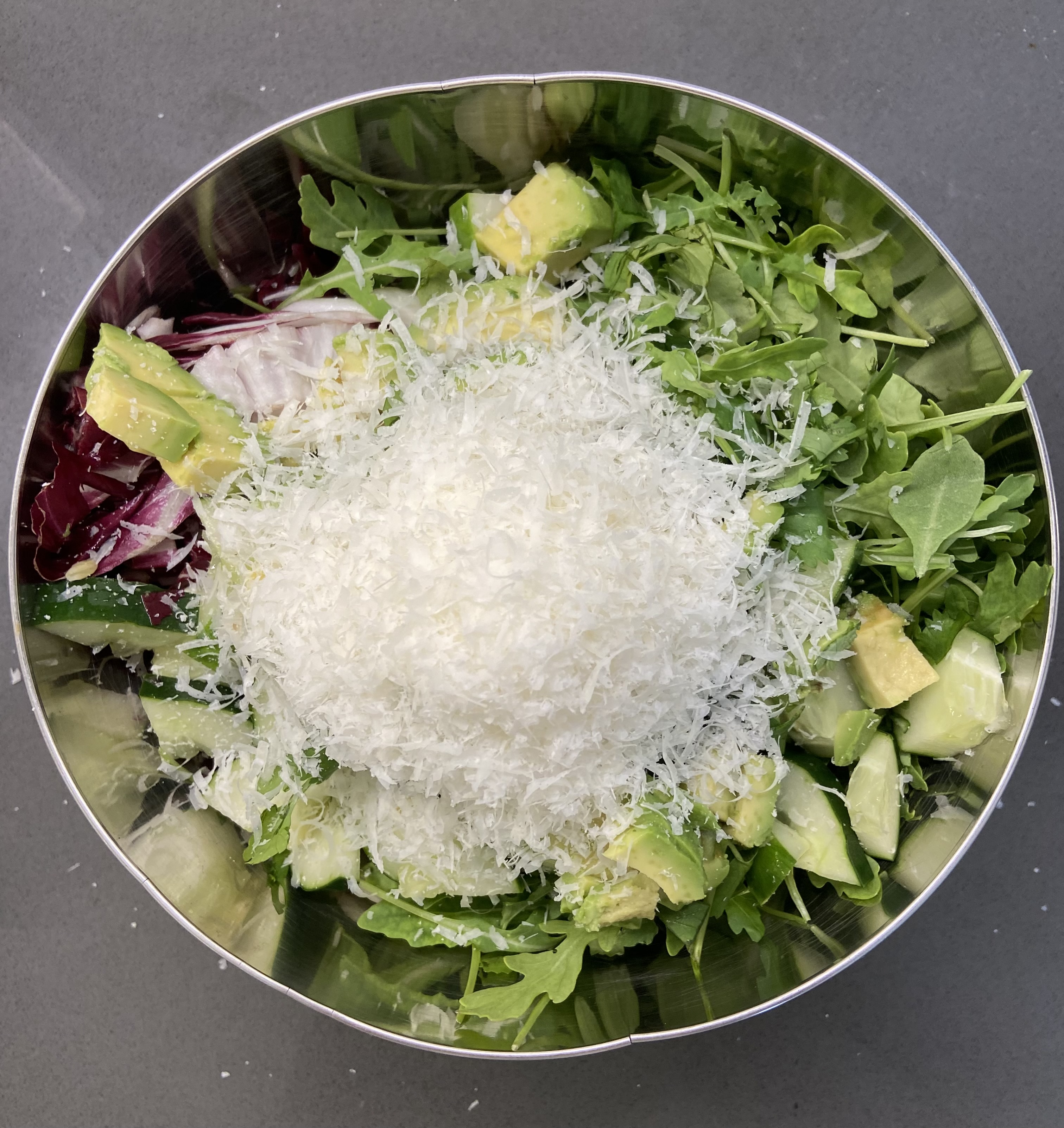 Parmesan added to salad